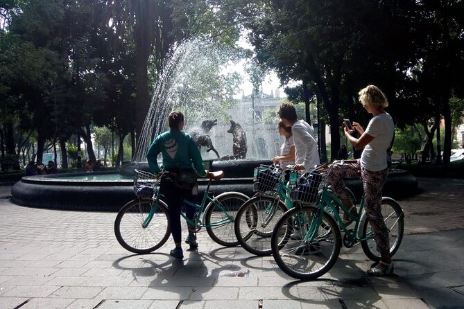 Frida's Heart Guided Biking Tour in Coyoacán - Stop 3 at Plaza Centenario: fountains, old Cathedral views, and photo-friendly alleys