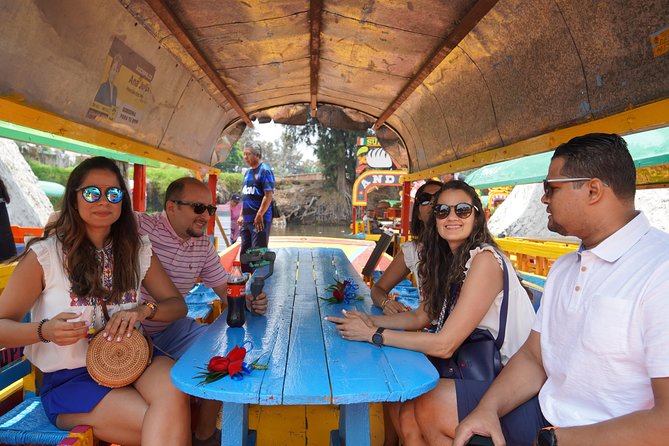Xochimilco & Coyoacan with Frida Kahlo Private Tour - Xochimilco Canals by Trajinera: Boat Ride, Street Snacks, and Market Energy